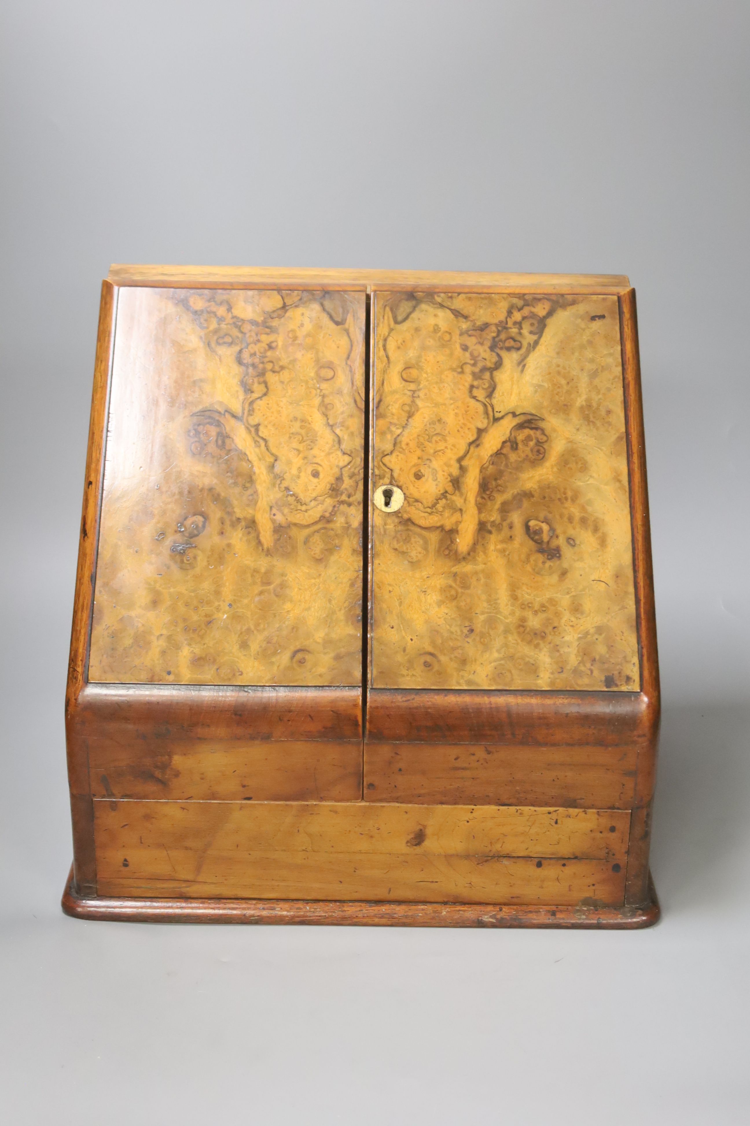 A Victorian walnut stationery box with fitted interior, height 31cm